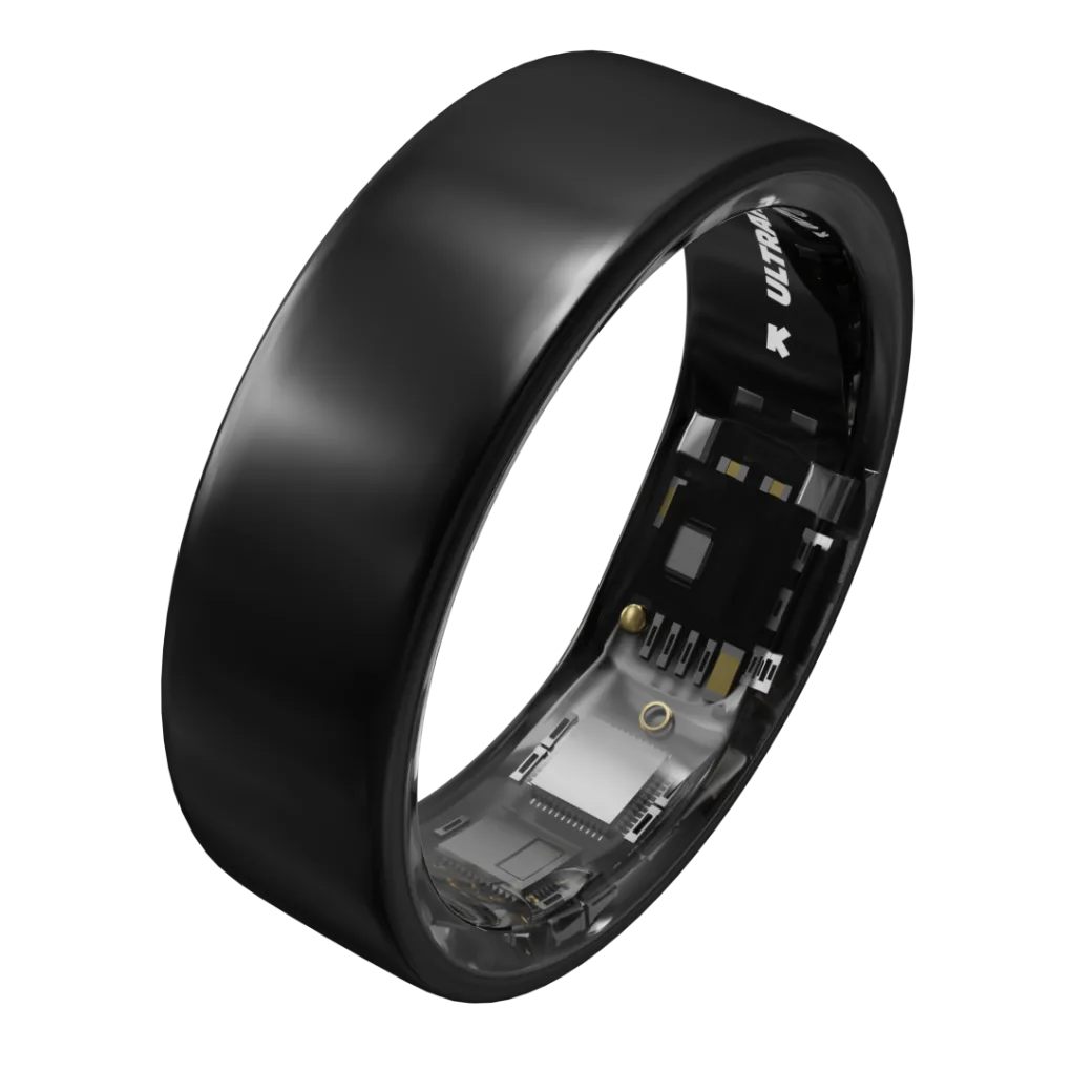 Schwarzer, glänzender Ring schräg stehend: breite glatte Außenfläche, innen ein weißer ULTRAHUMAN-Schriftzug mit Pfeil und dahinter unter transparentem Material Chips, Leiterbahnen und goldene Kontaktpunkte